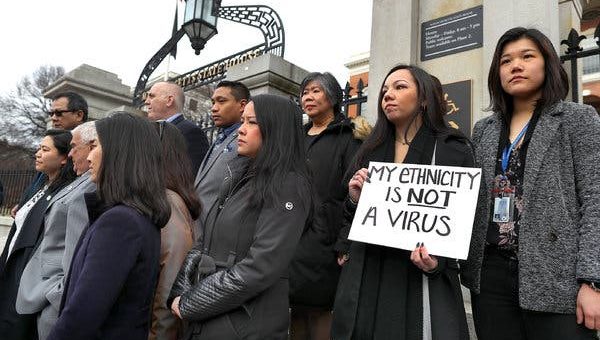 Members of the Asian American Commission condemning racism toward the Asian American community because of coronavirus, outside the Massachusetts State House in Boston in March.
